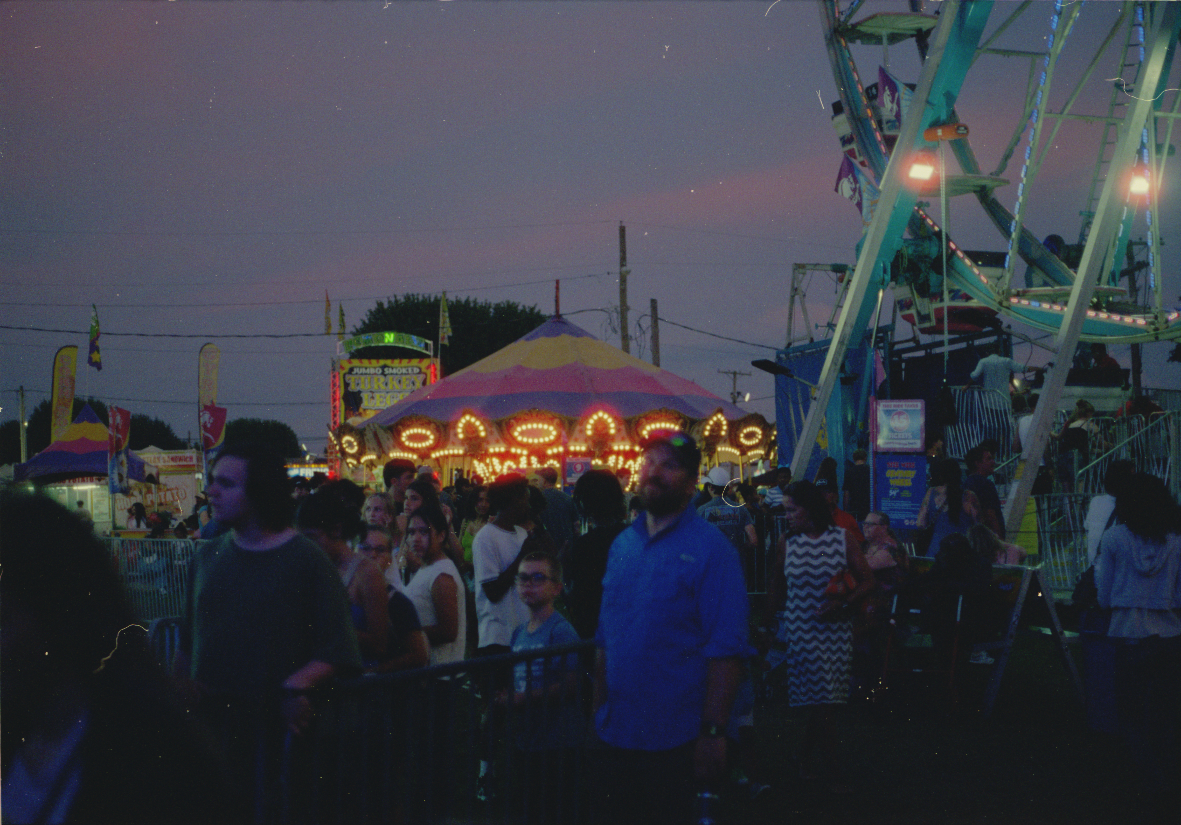 Ferris wheel spinning against the twilight